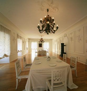View of the White Hall, including a table, Urach Palace
